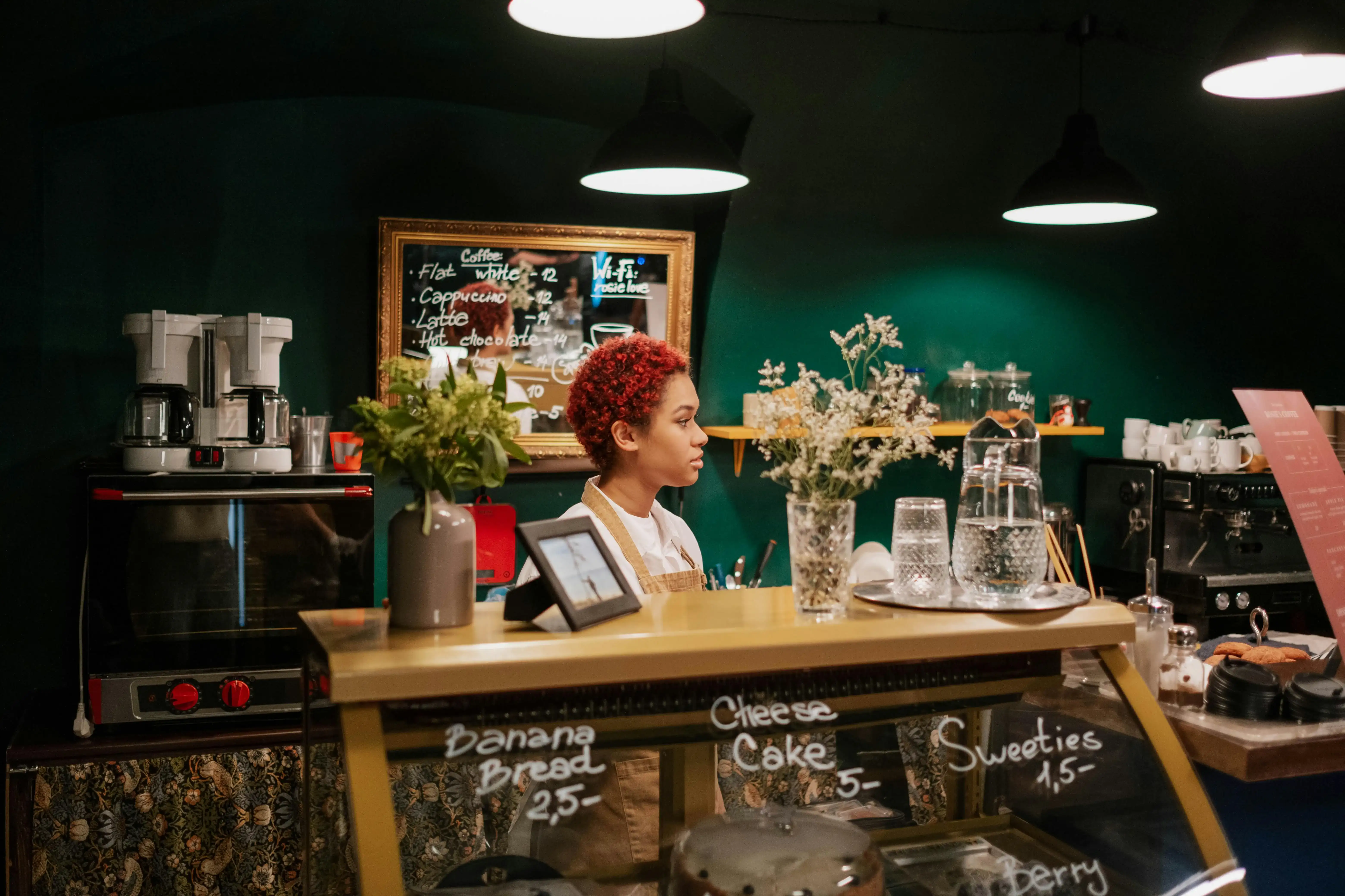 Barista at a cosy café counter